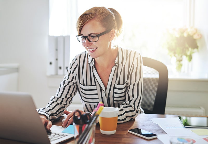 happy business woman working on laptop