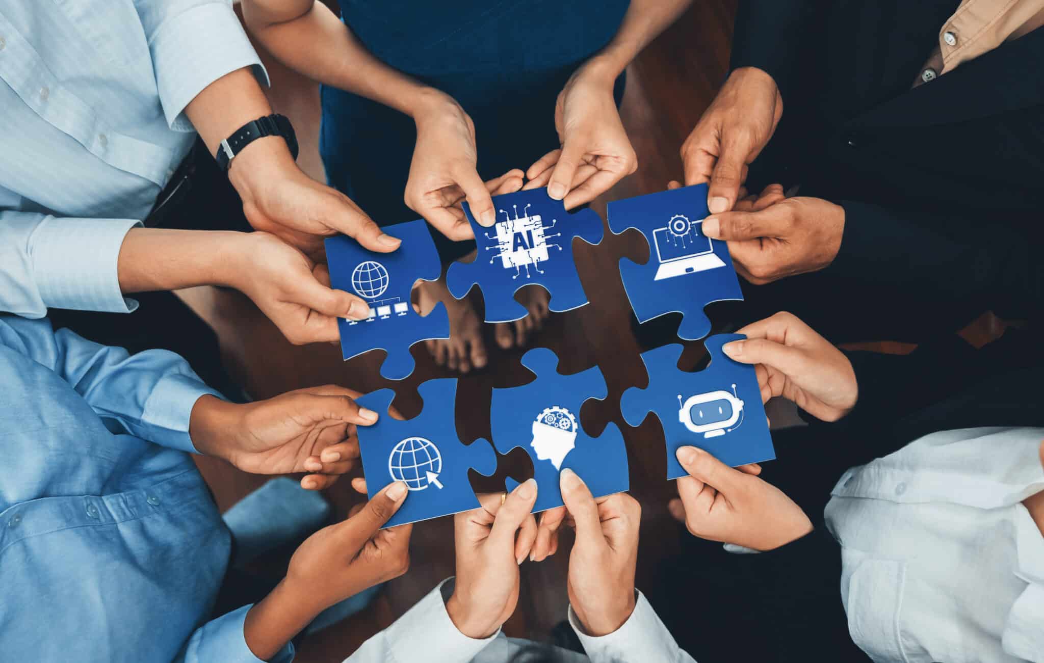 diverse hands collaborating on puzzle pieces symbolizing artificial intelligence, digital connectivity, and global innovations in a team environment. amity