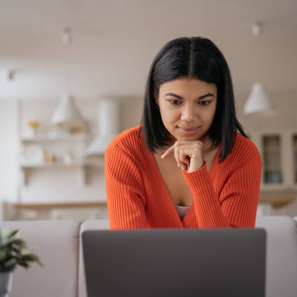 Young Woman Staring at Laptop Screen