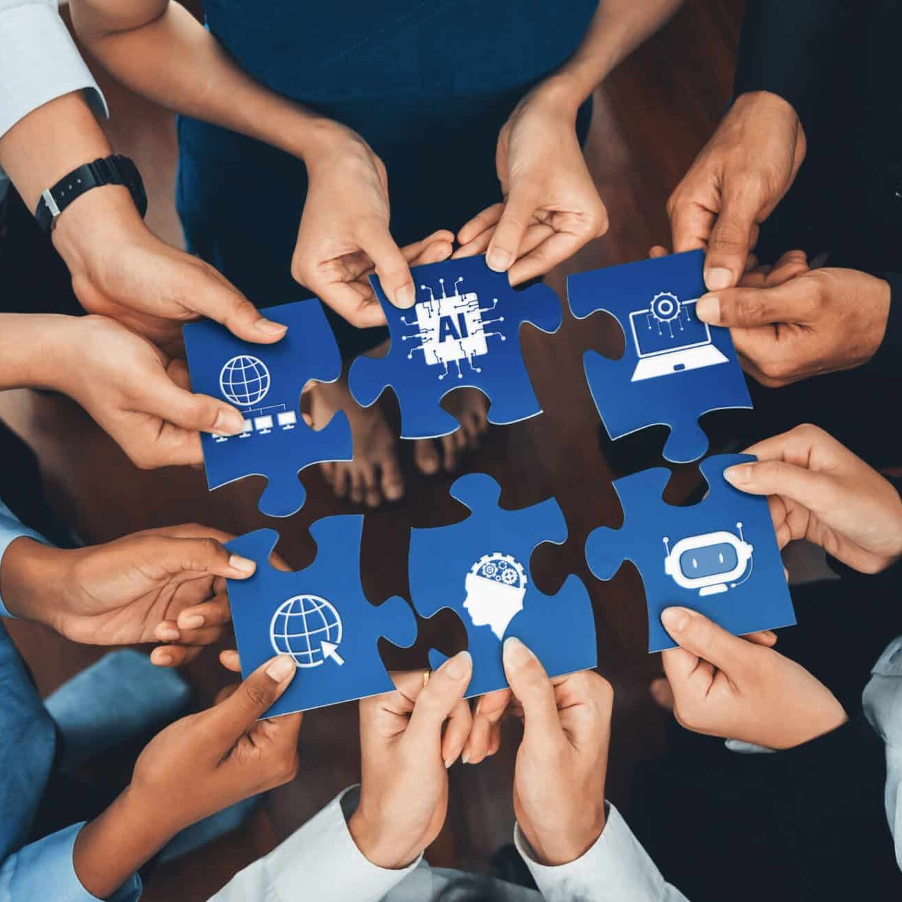 diverse hands collaborating on puzzle pieces symbolizing artificial intelligence, digital connectivity, and global innovations in a team environment. amity