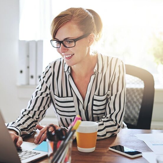 happy business woman working on laptop